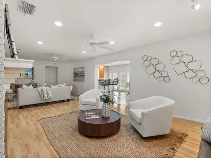 a living room with furniture and a table