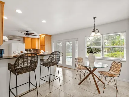 a kitchen with a sink a counter top space and stainless steel appliances