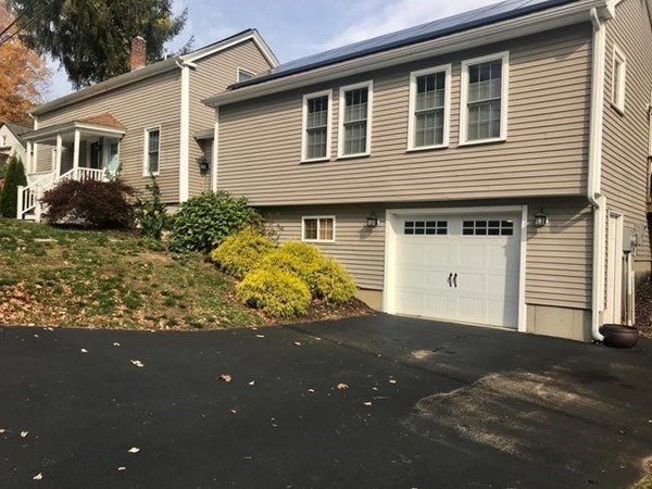 8 Collette Road Sturbridge, MA 01518 - Photo 1 of 28 a front view of a house with a yard and garage
