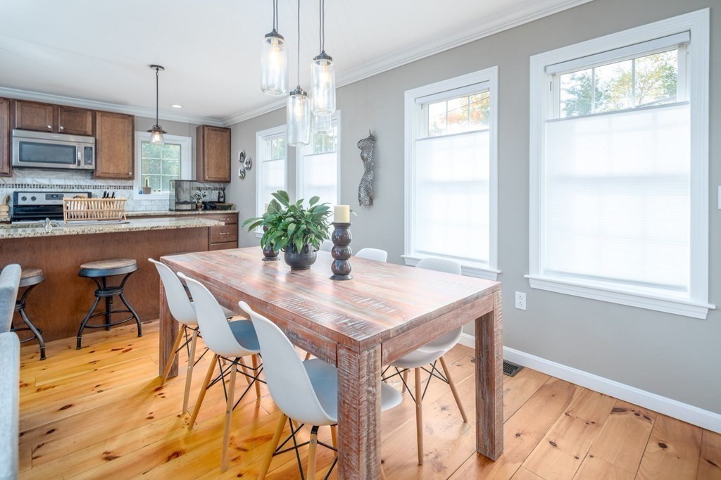 8 Collette Road Sturbridge, MA 01518 - Photo 13 of 28 a view of a dining room with furniture and wooden floor