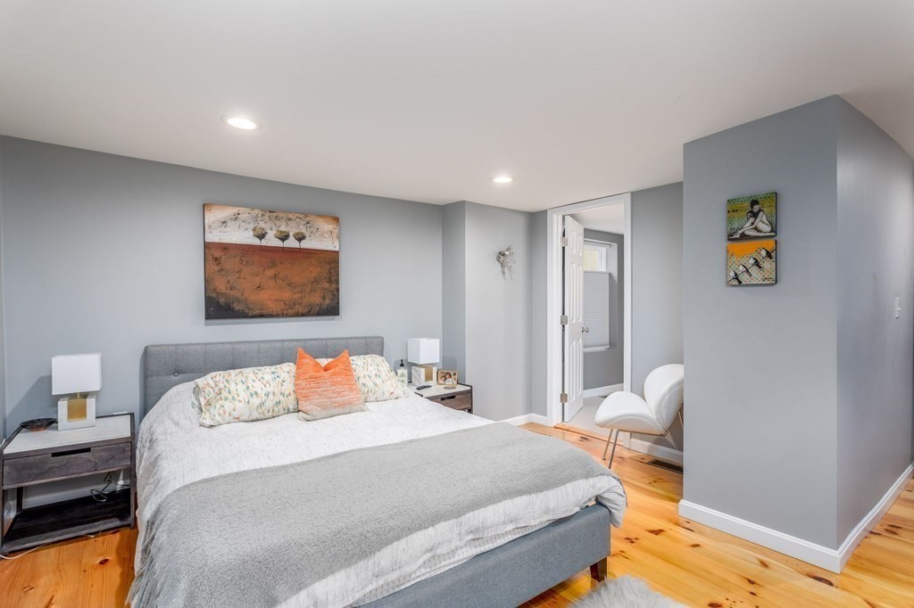 8 Collette Road Sturbridge, MA 01518 - Photo 14 of 28 a bedroom with a bed and painting on the wall