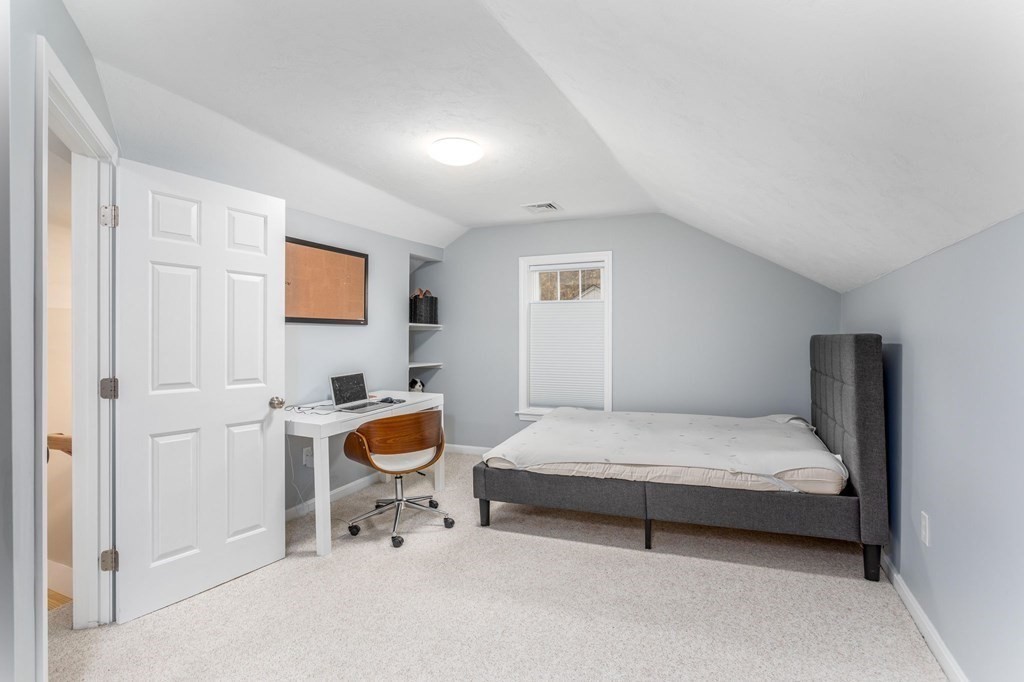 8 Collette Road Sturbridge, MA 01518 - Photo 18 of 28 a bedroom with a bed and a chair