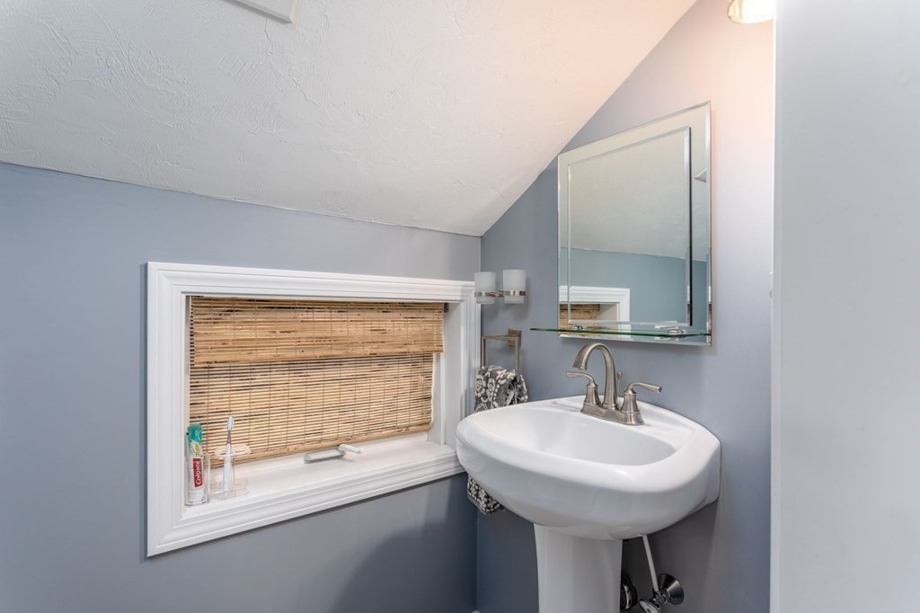 8 Collette Road Sturbridge, MA 01518 - Photo 20 of 28 a bathroom with a sink a mirror and a window