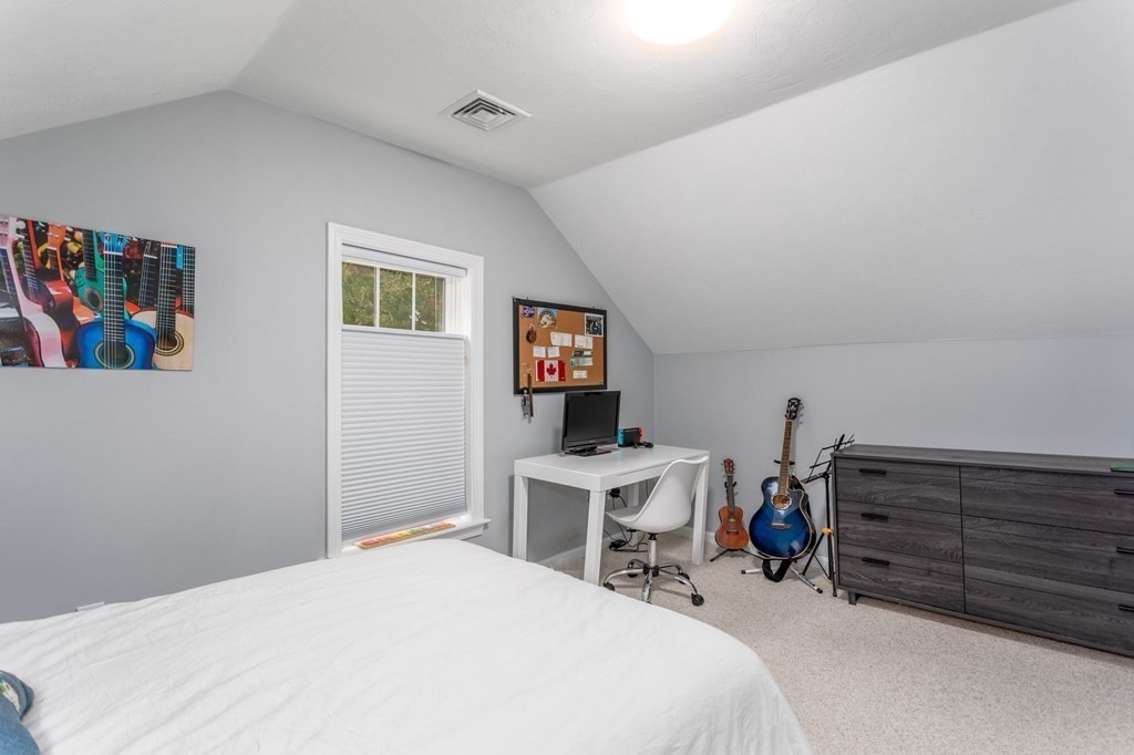 8 Collette Road Sturbridge, MA 01518 - Photo 22 of 28 a bedroom with a bed and a desk