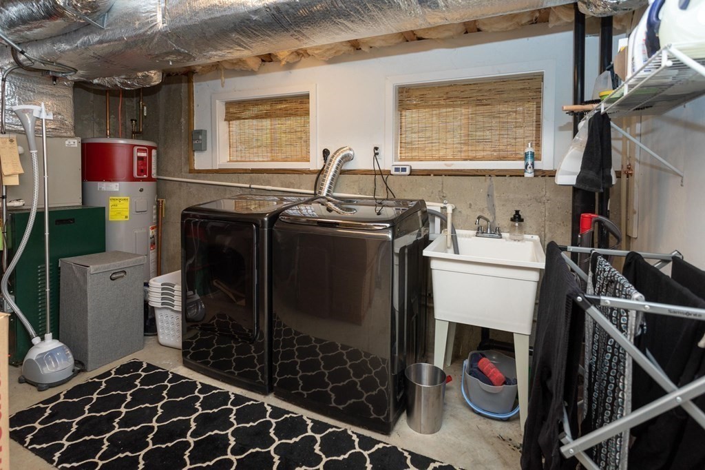 8 Collette Road Sturbridge, MA 01518 - Photo 23 of 28 a storage room with washer and dryer