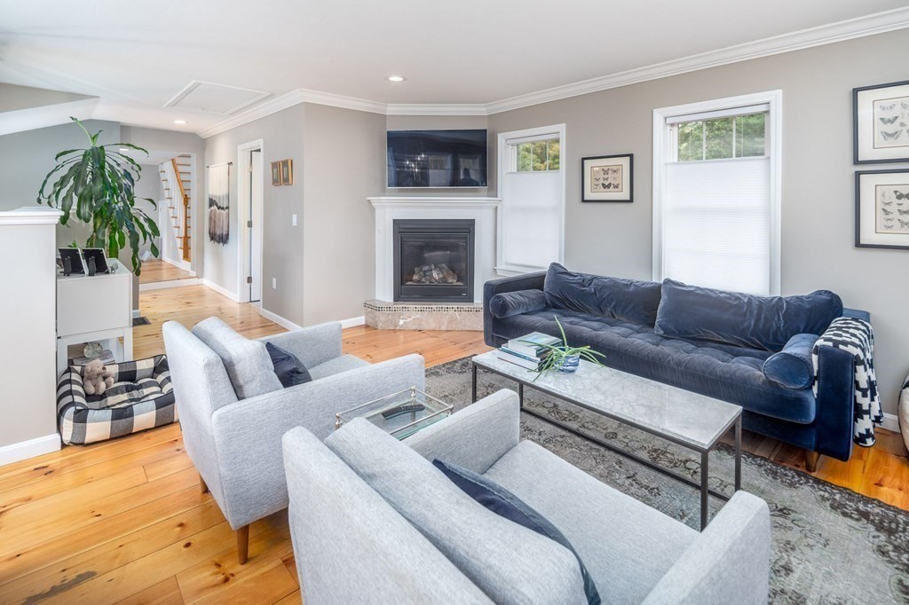 8 Collette Road Sturbridge, MA 01518 - Photo 10 of 28 a living room with furniture or couch and a fireplace