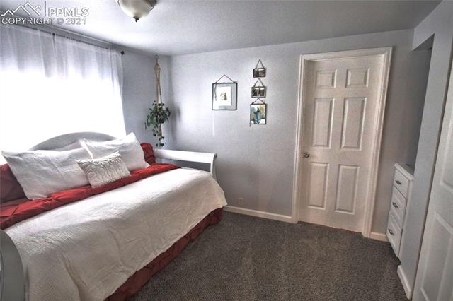 6095 West Condor Road Peyton, CO 80831 - Photo 13 of 33 Guest bedroom with attached bath.