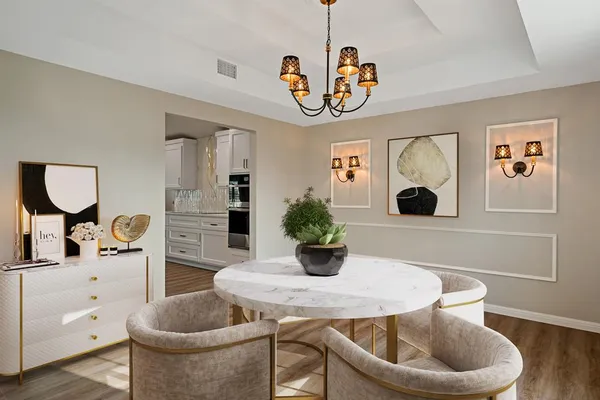 a dining room with furniture a livingroom and chandelier