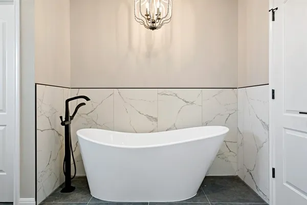 a white bath tub sitting in a bathroom