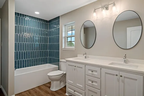 a bathroom with a toilet sink and tub