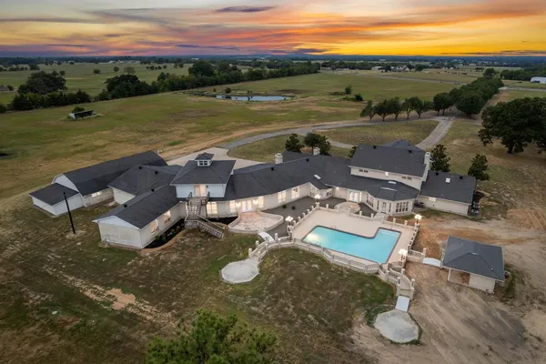 an aerial view of a house with garden space and outdoor space