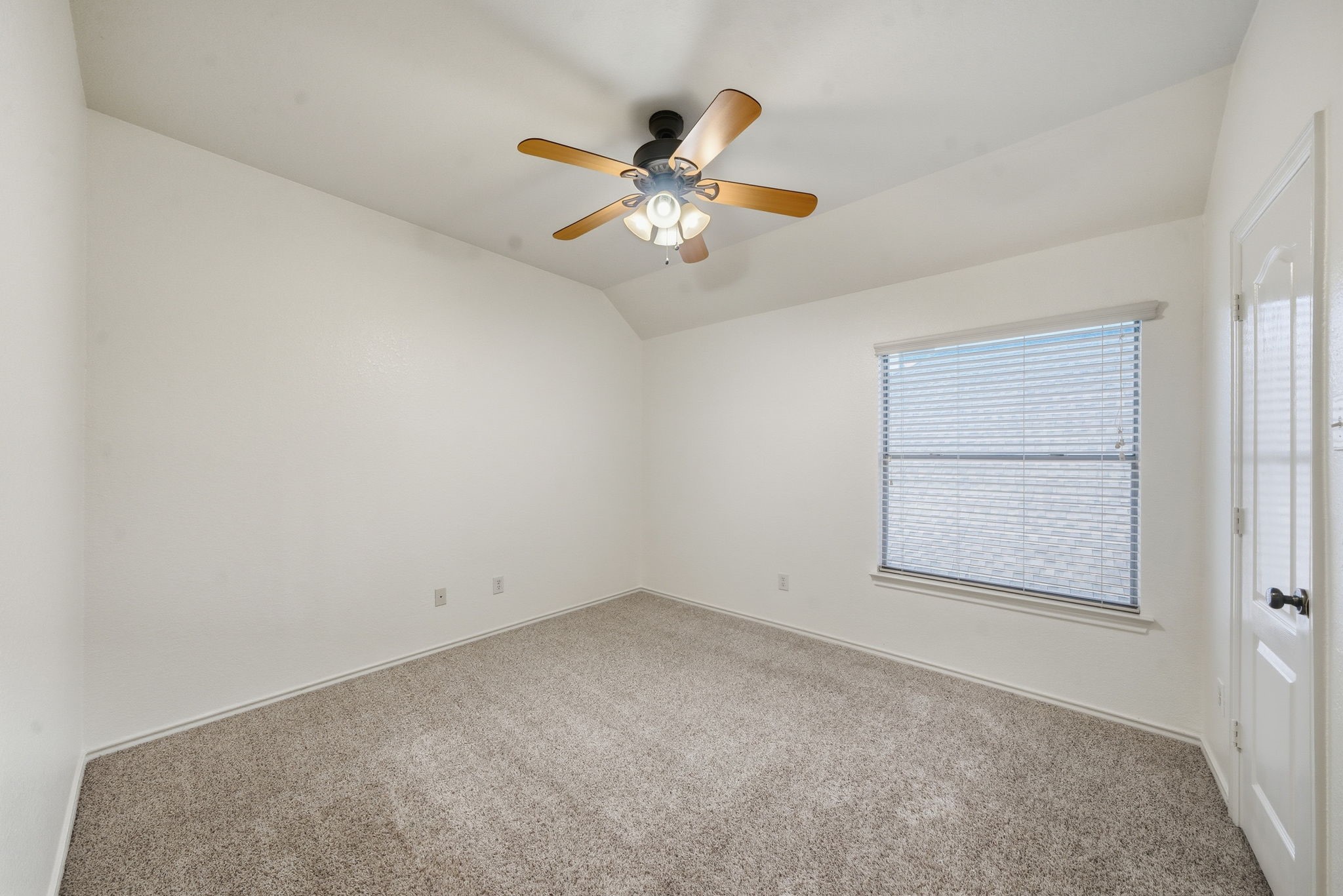 23139 Tranquil Spring Lane Katy, TX 77494 - Photo 16 of 22 an empty room with a window and a ceiling fan
