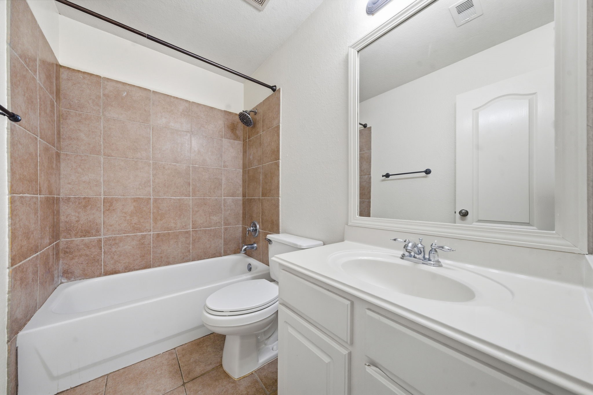 23139 Tranquil Spring Lane Katy, TX 77494 - Photo 17 of 22 a bathroom with a sink a toilet and a bathtub
