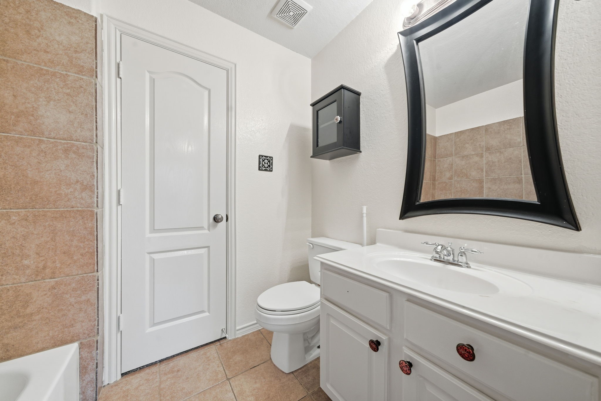 23139 Tranquil Spring Lane Katy, TX 77494 - Photo 20 of 22 a bathroom with a sink a toilet and mirror