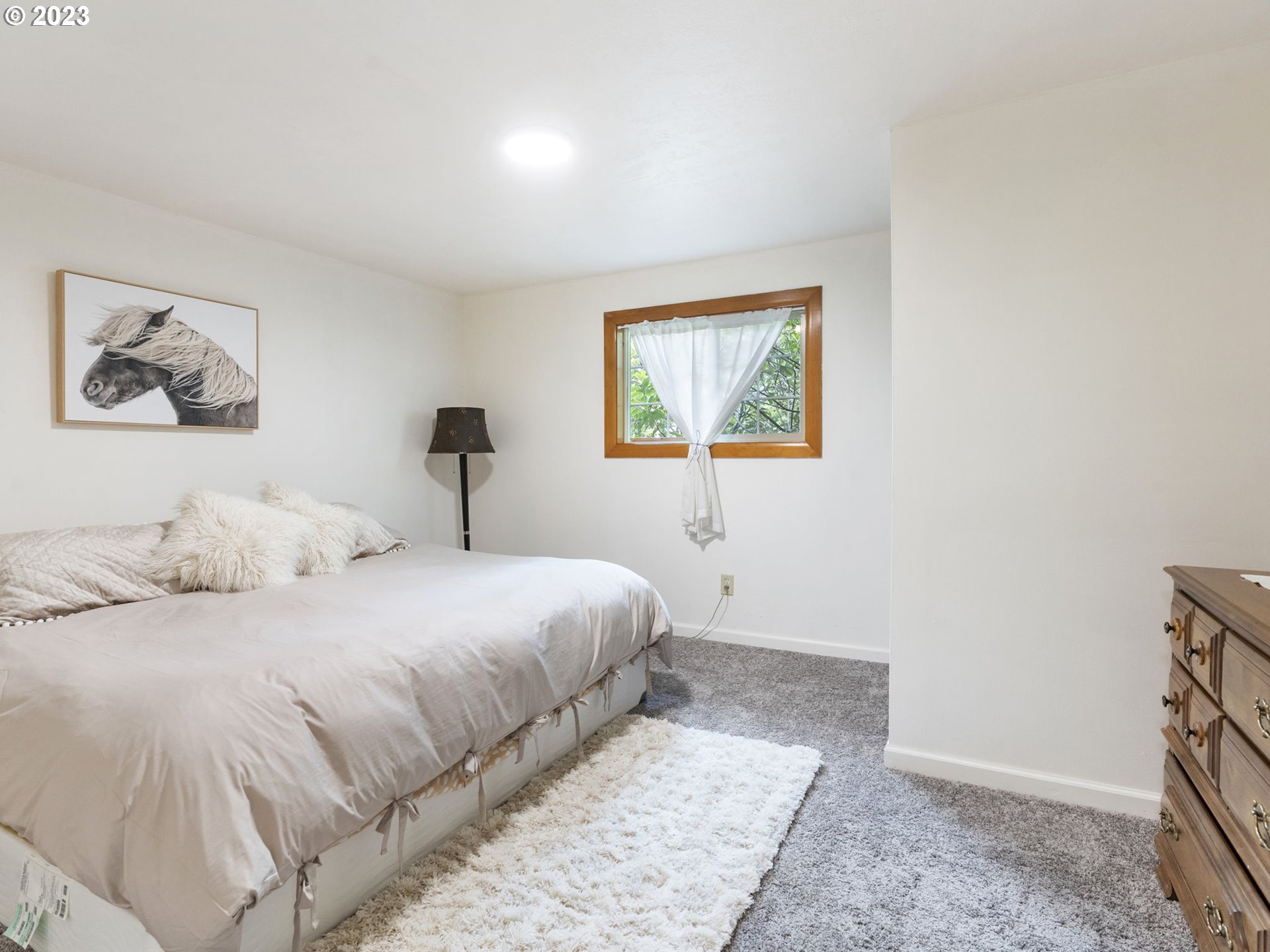 26271 South Habelt Road Estacada, OR 97023 - Photo 20 of 32 a bedroom with a bed and a painting on the wall