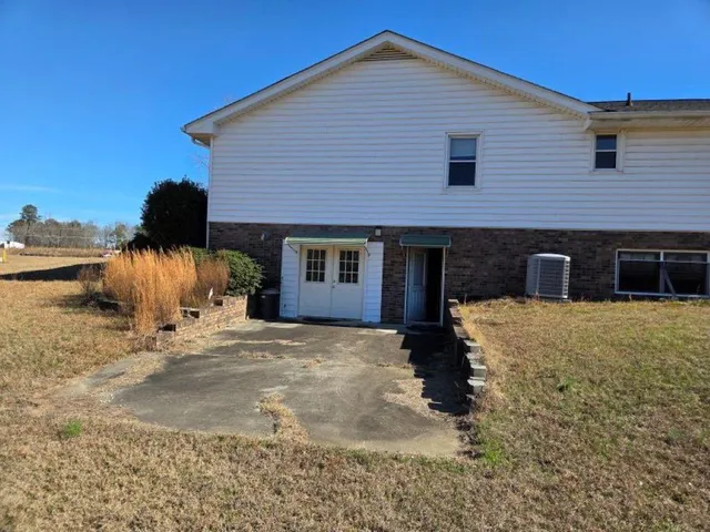 a view of a swimming pool with an outdoor seating
