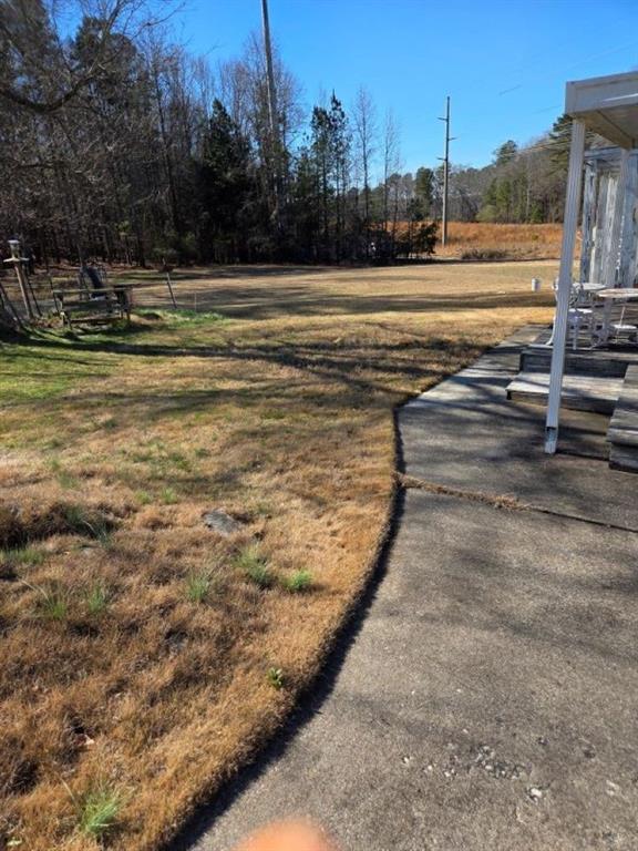 2944 Gravel Springs Road Buford, GA 30519 - Photo 4 of 10 a view of a swimming pool with an outdoor seating