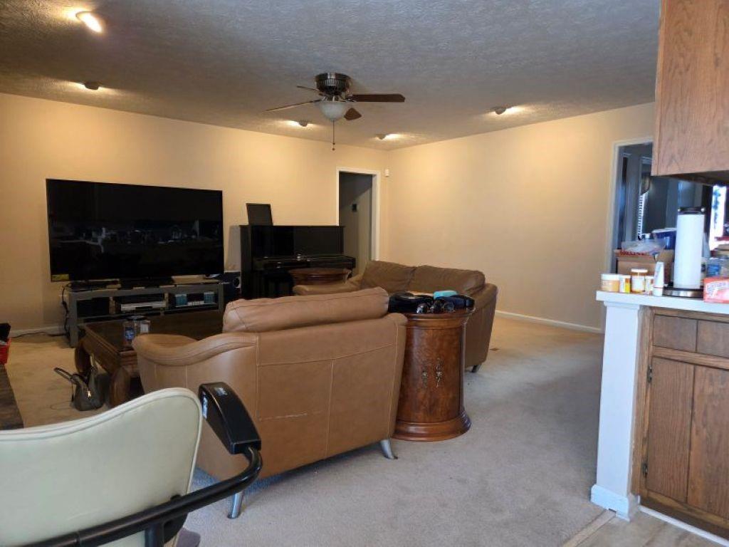2944 Gravel Springs Road Buford, GA 30519 - Photo 8 of 10 a living room with furniture and a flat screen tv
