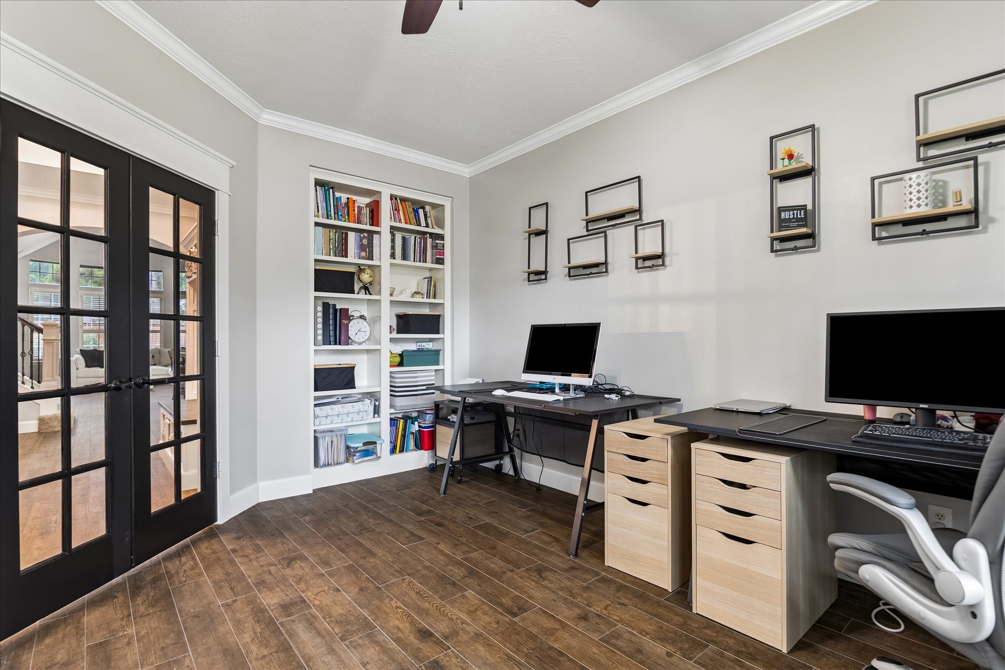 23039 Enchanted Landing Lane Katy, TX 77494 - Photo 6 of 30 a view of a workspace with furniture and bookshelf