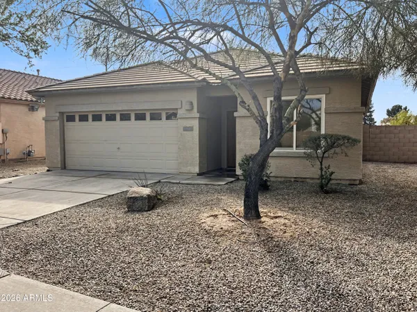 a front view of a house with parking area