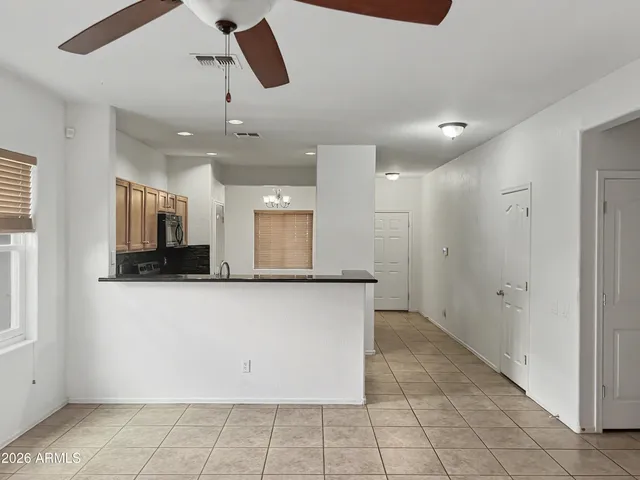 a kitchen with stainless steel appliances a refrigerator and a microwave