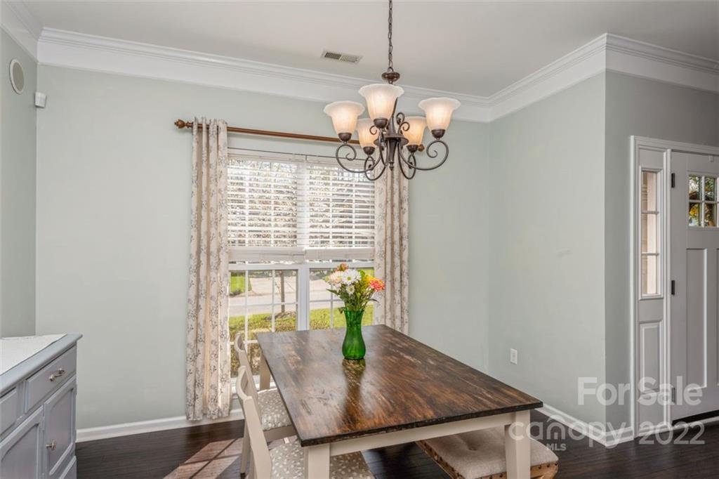 739 West Cheval Drive Fort Mill, SC 29708 - Photo 11 of 36 a view of a dining room with furniture wooden floor and chandelier