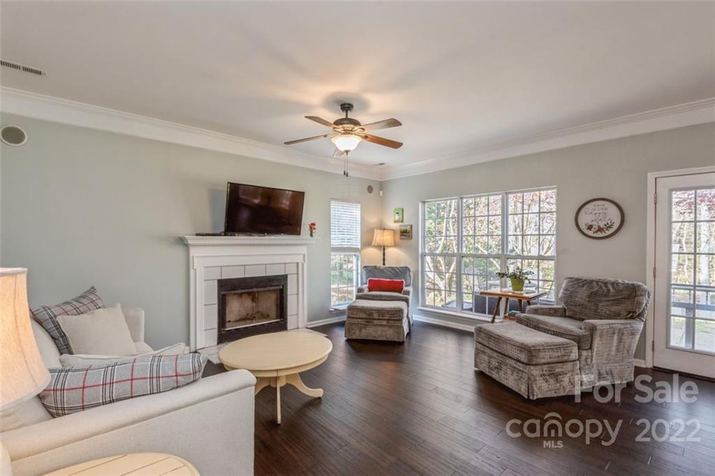 739 West Cheval Drive Fort Mill, SC 29708 - Photo 13 of 36 a living room with furniture a fireplace and a flat screen tv