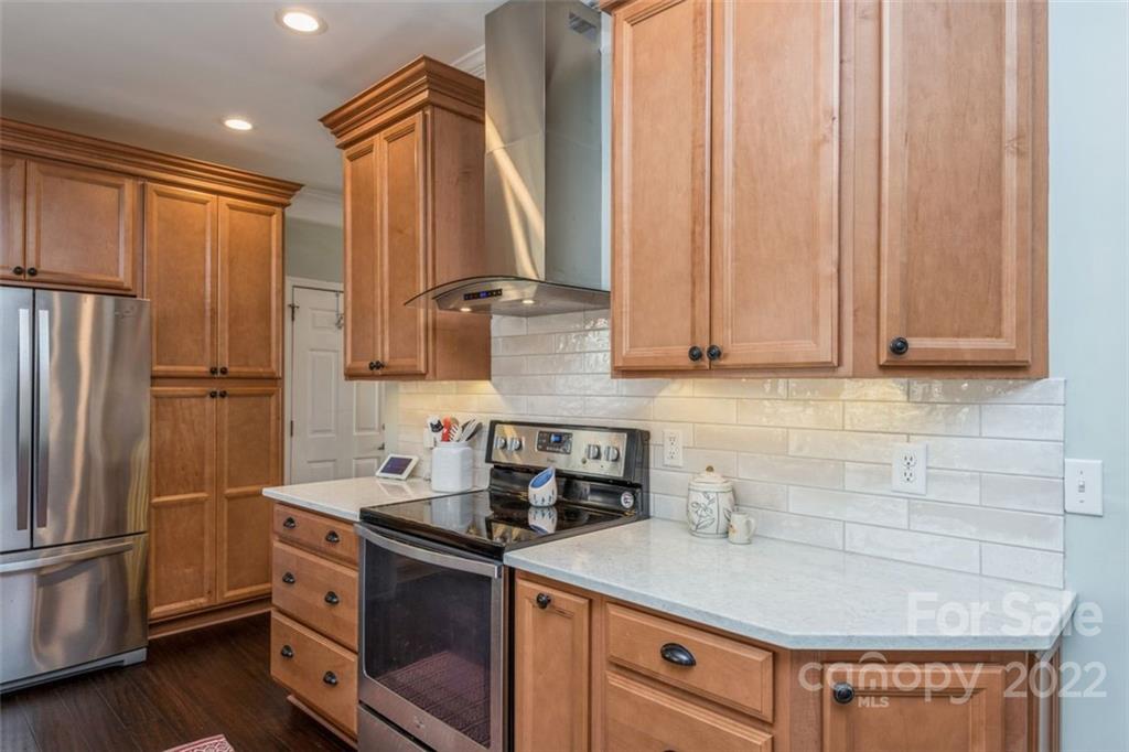 739 West Cheval Drive Fort Mill, SC 29708 - Photo 18 of 36 a kitchen with stainless steel appliances a refrigerator sink and cabinets