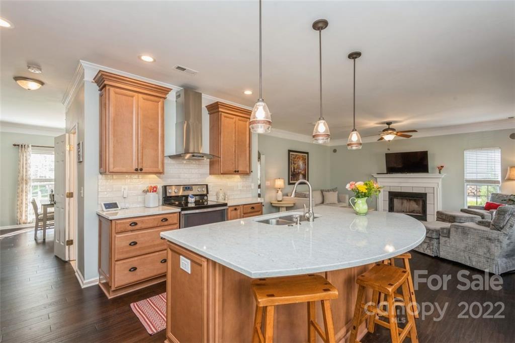 739 West Cheval Drive Fort Mill, SC 29708 - Photo 20 of 36 a kitchen with a table chairs sink and wooden floor