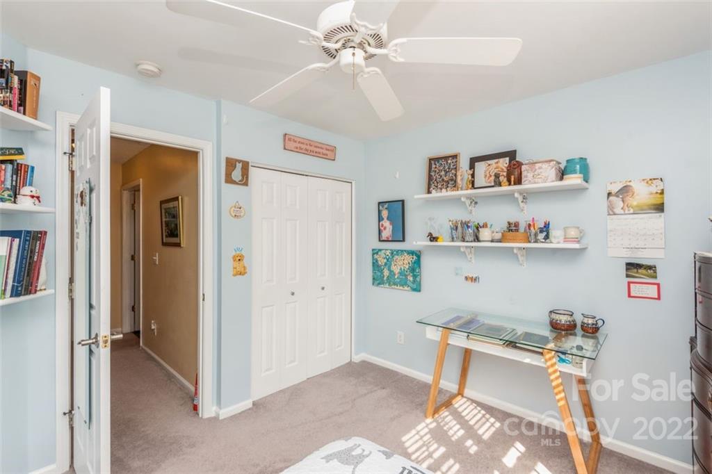 739 West Cheval Drive Fort Mill, SC 29708 - Photo 23 of 36 a workspace with furniture and a book shelf