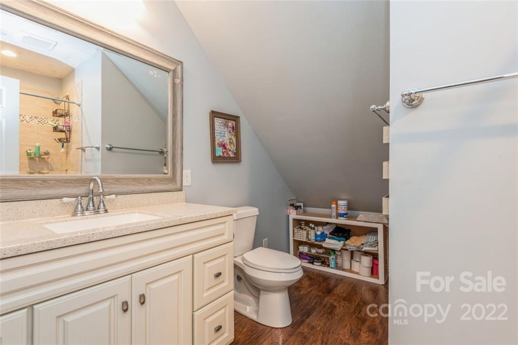 739 West Cheval Drive Fort Mill, SC 29708 - Photo 26 of 36 a bathroom with a granite countertop toilet sink and mirror
