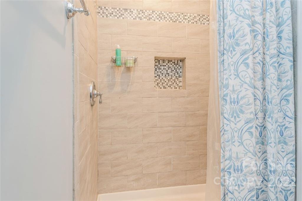 739 West Cheval Drive Fort Mill, SC 29708 - Photo 27 of 36 a bathroom with a shower and a shower curtain