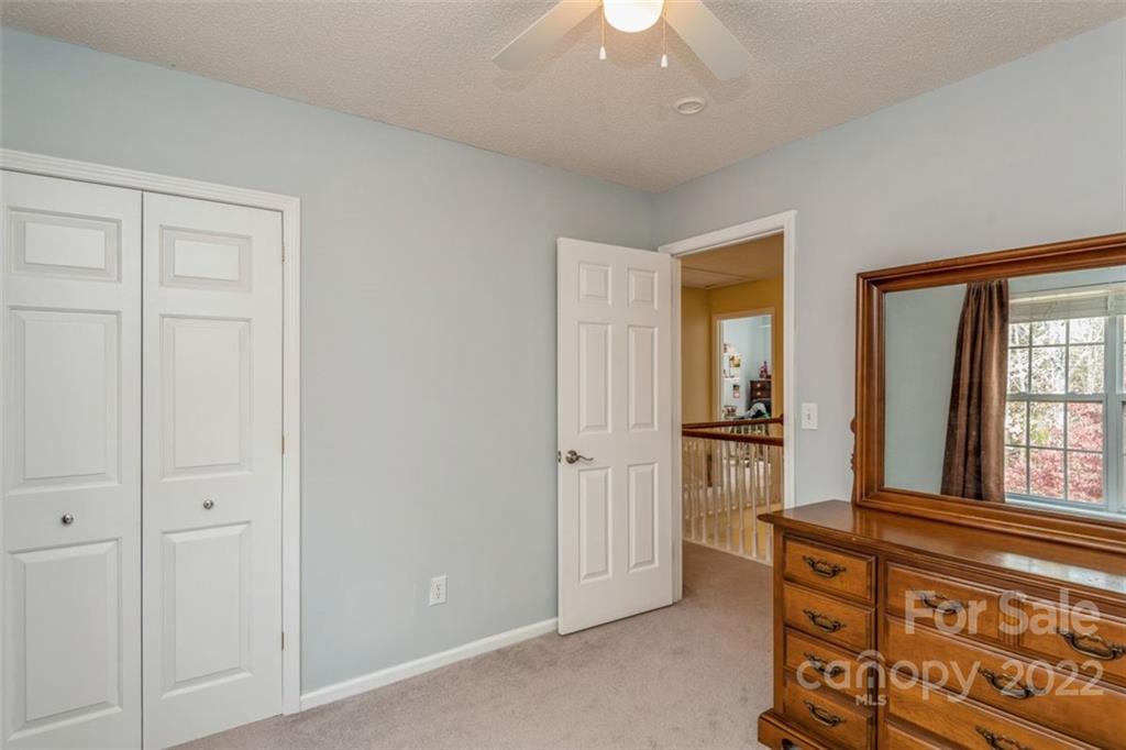 739 West Cheval Drive Fort Mill, SC 29708 - Photo 31 of 36 wooden floor with windows and chandelier