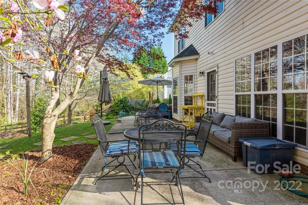 739 West Cheval Drive Fort Mill, SC 29708 - Photo 4 of 36 a view of a patio with a table and chairs