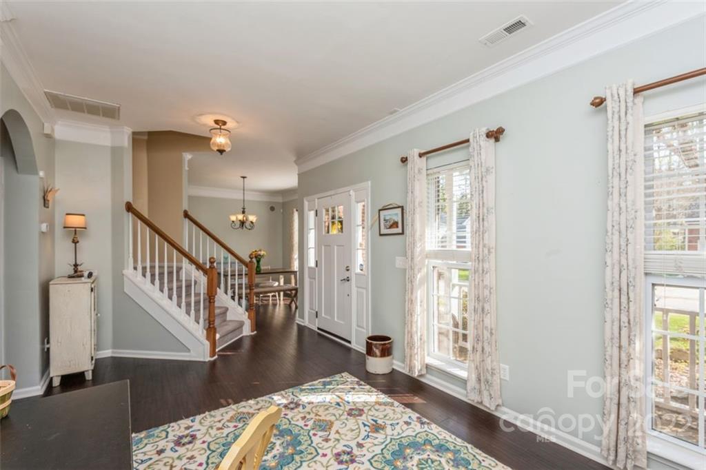 739 West Cheval Drive Fort Mill, SC 29708 - Photo 9 of 36 a view of a hallway with wooden floor and windows