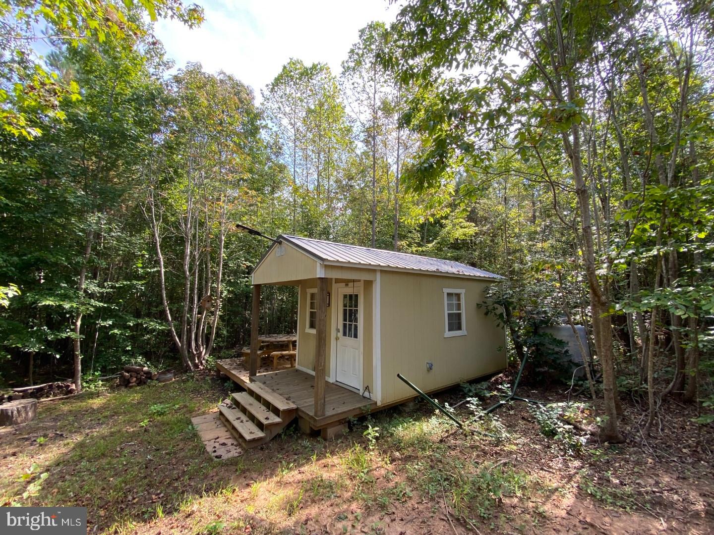 684 Squirrel Hollow Road Alberta, VA 23821 - Photo 10 of 43 Charming cabin nestled in serene woods.