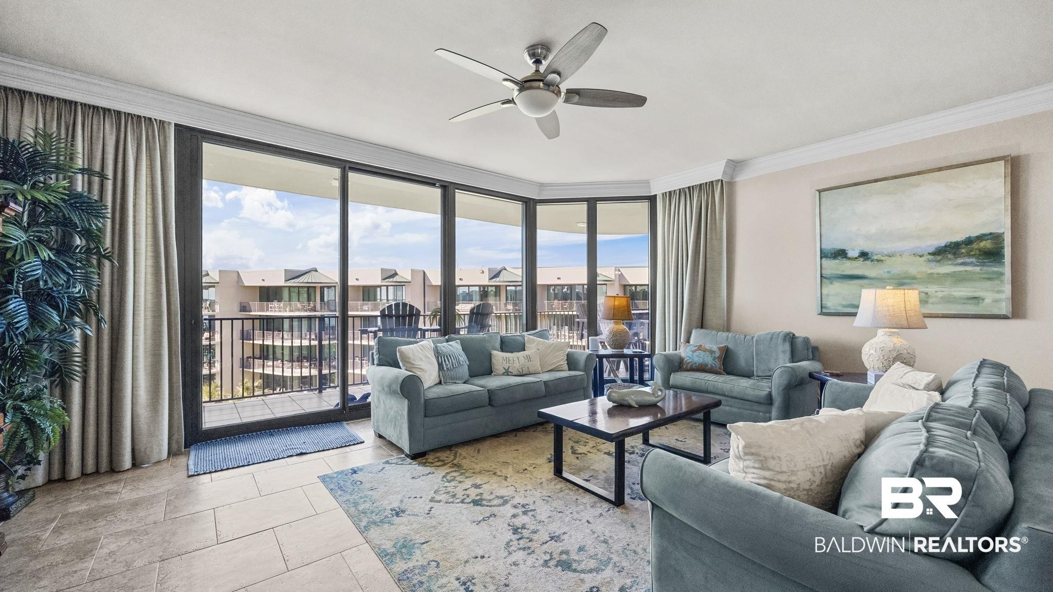 27580 Canal Road, Unit 1526 Orange Beach, AL 36561 - Photo 6 of 49 Living room featuring ornamental molding, expansive windows, a ceiling fan, and tile patterned flooring