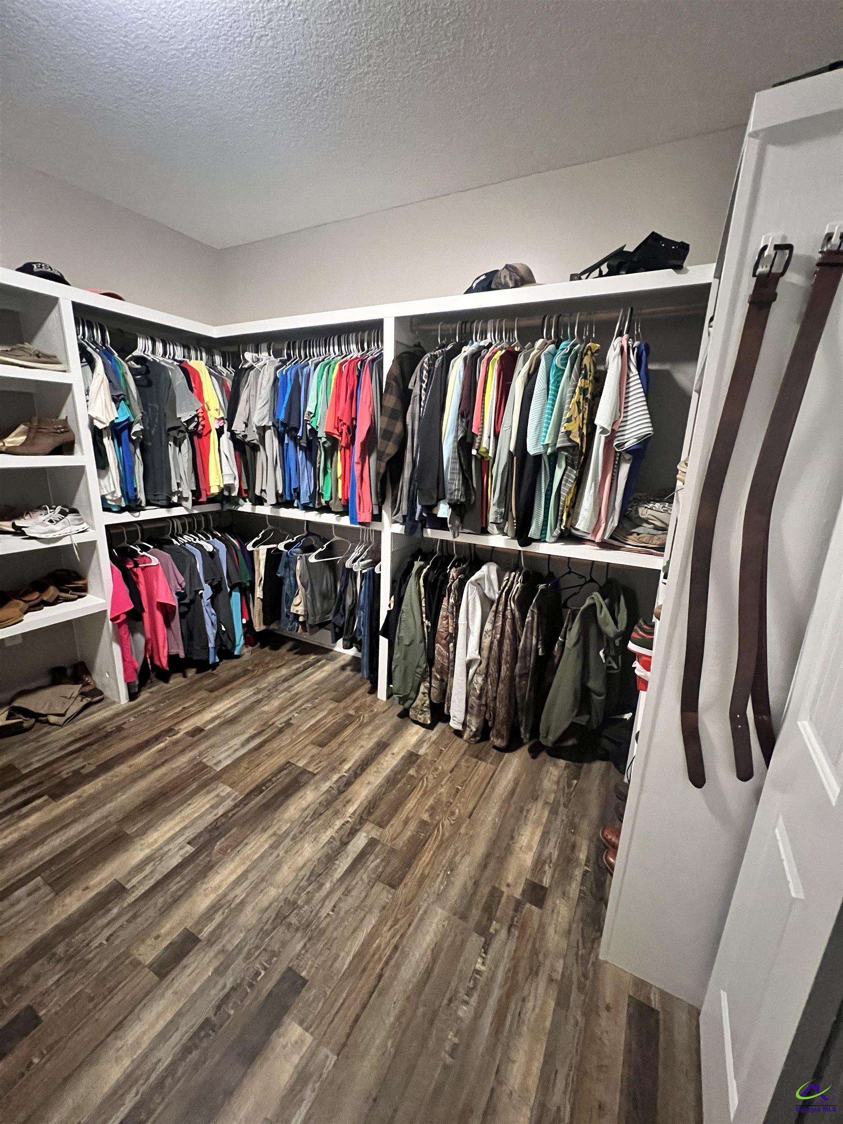 2203 Old Macon Road Montrose, GA 31065 - Photo 26 of 64 a view of walk in closet with clothes and shoes