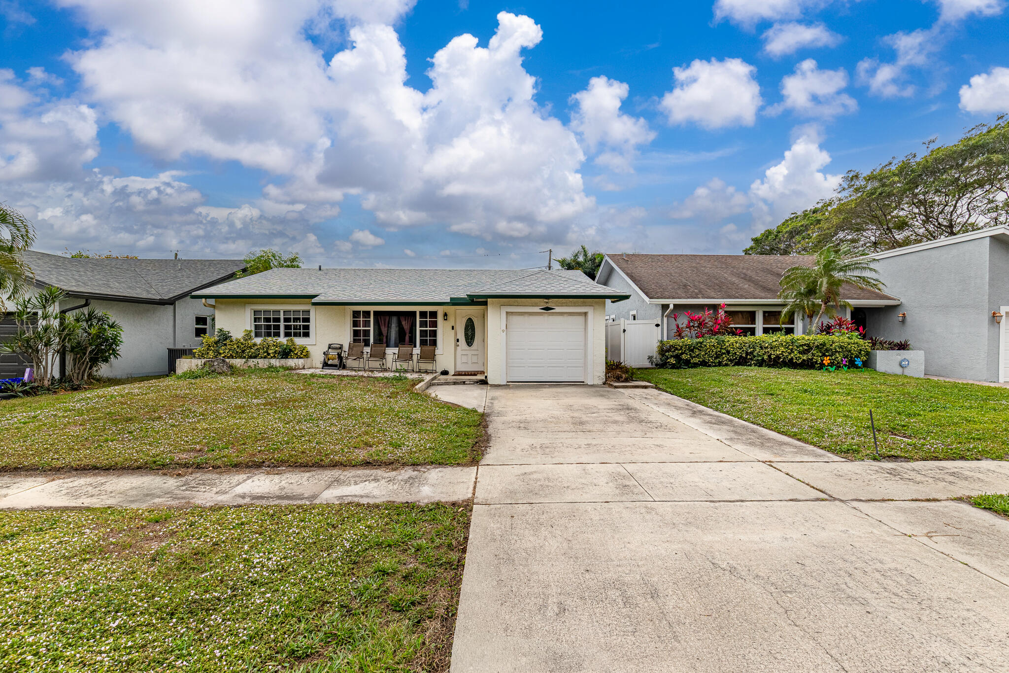 a front view of a house with a yard