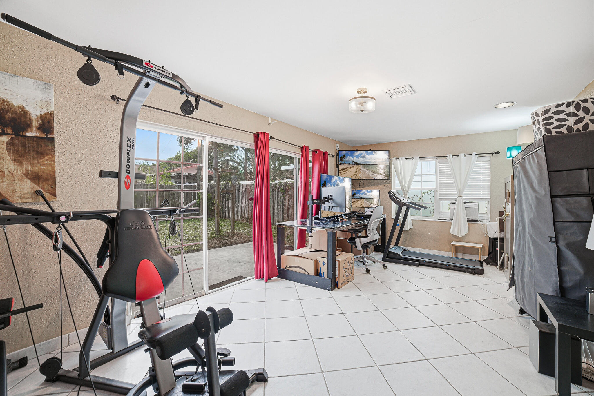 564 Northwest 55th Street Boca Raton, FL 33487 - Photo 13 of 26 a view of a room with gym equipment