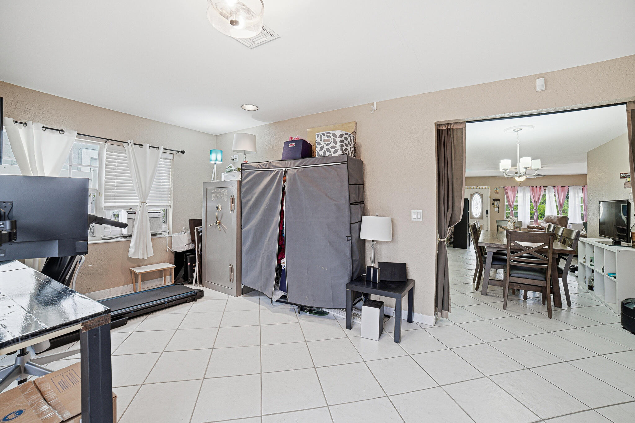 564 Northwest 55th Street Boca Raton, FL 33487 - Photo 14 of 26 a living room with furniture a computer on desk and chair