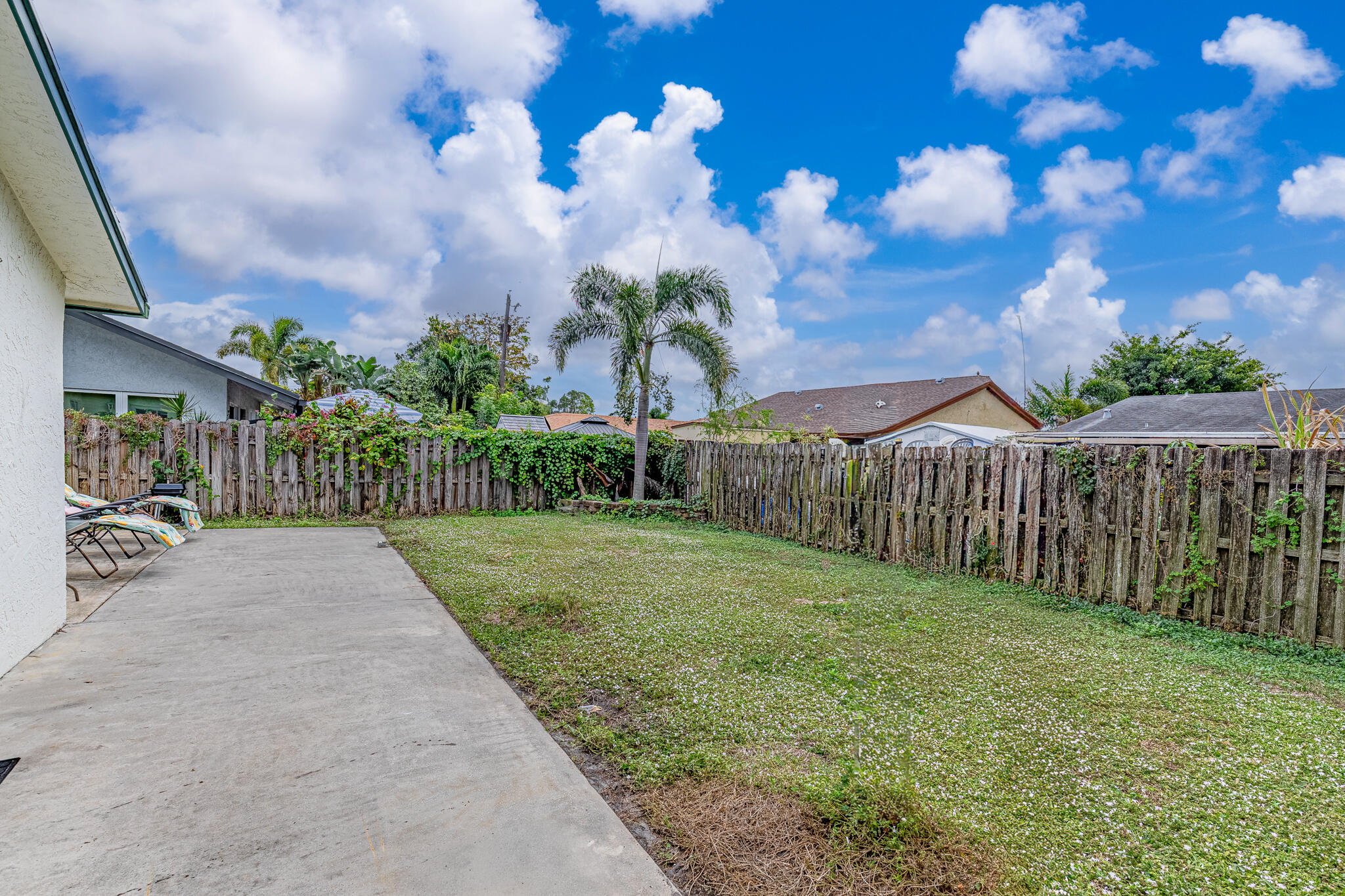 564 Northwest 55th Street Boca Raton, FL 33487 - Photo 26 of 26 a view of a garden with a pathway