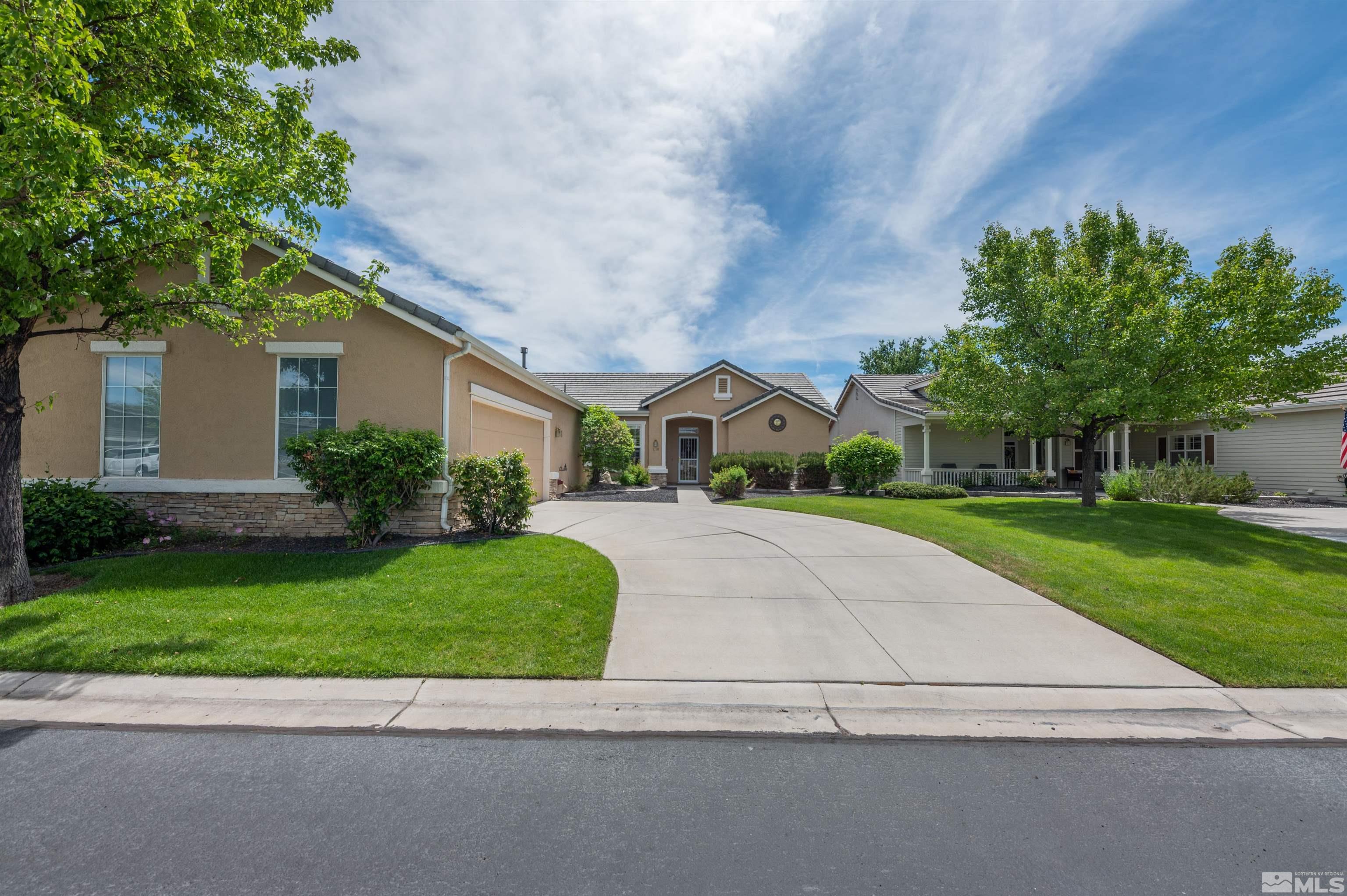 1416 Wild Wolf Way Reno, NV 89521 - Photo 1 of 39 a front view of a house with a yard