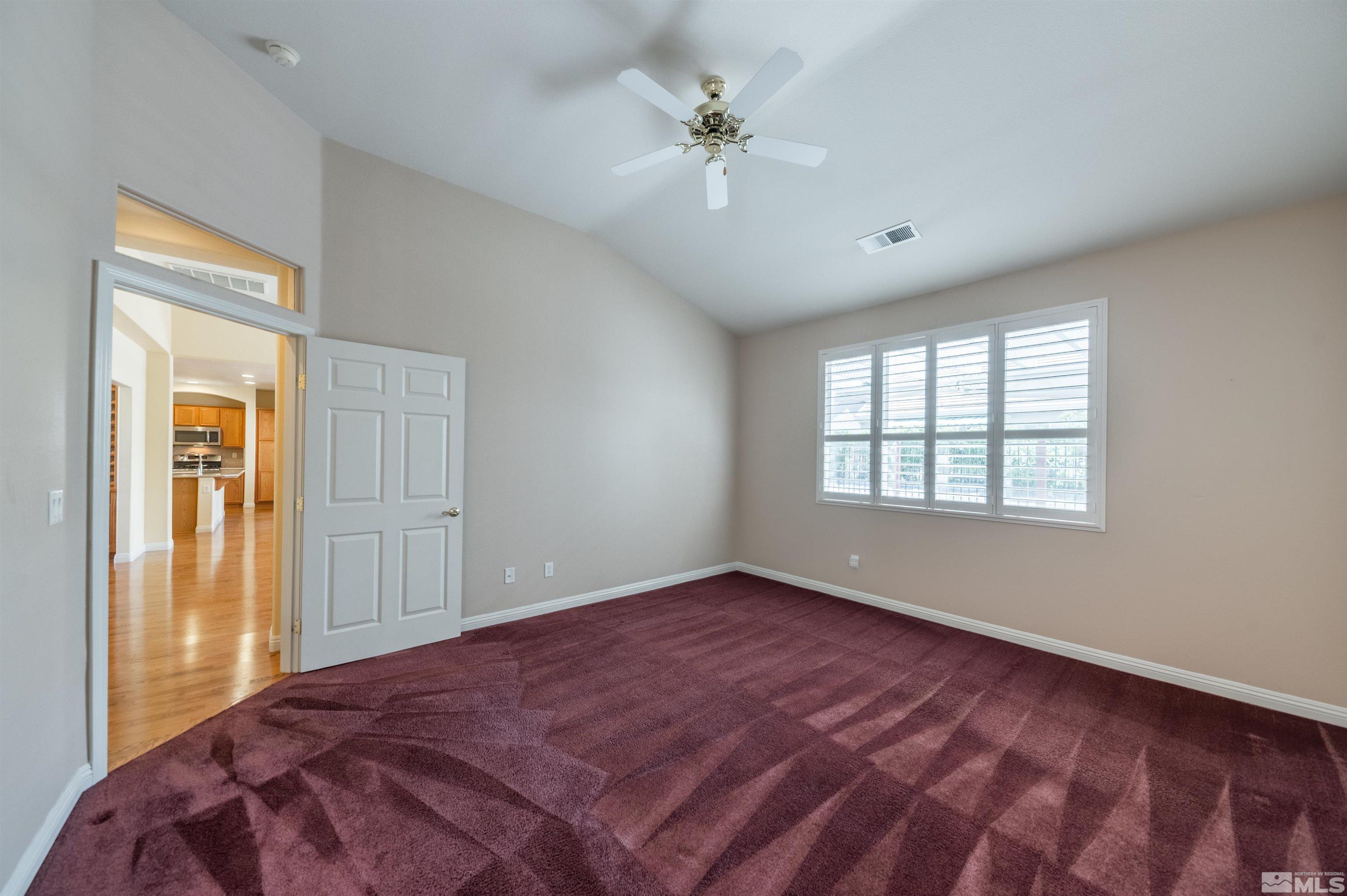 1416 Wild Wolf Way Reno, NV 89521 - Photo 21 of 39 a view of an empty room with a window