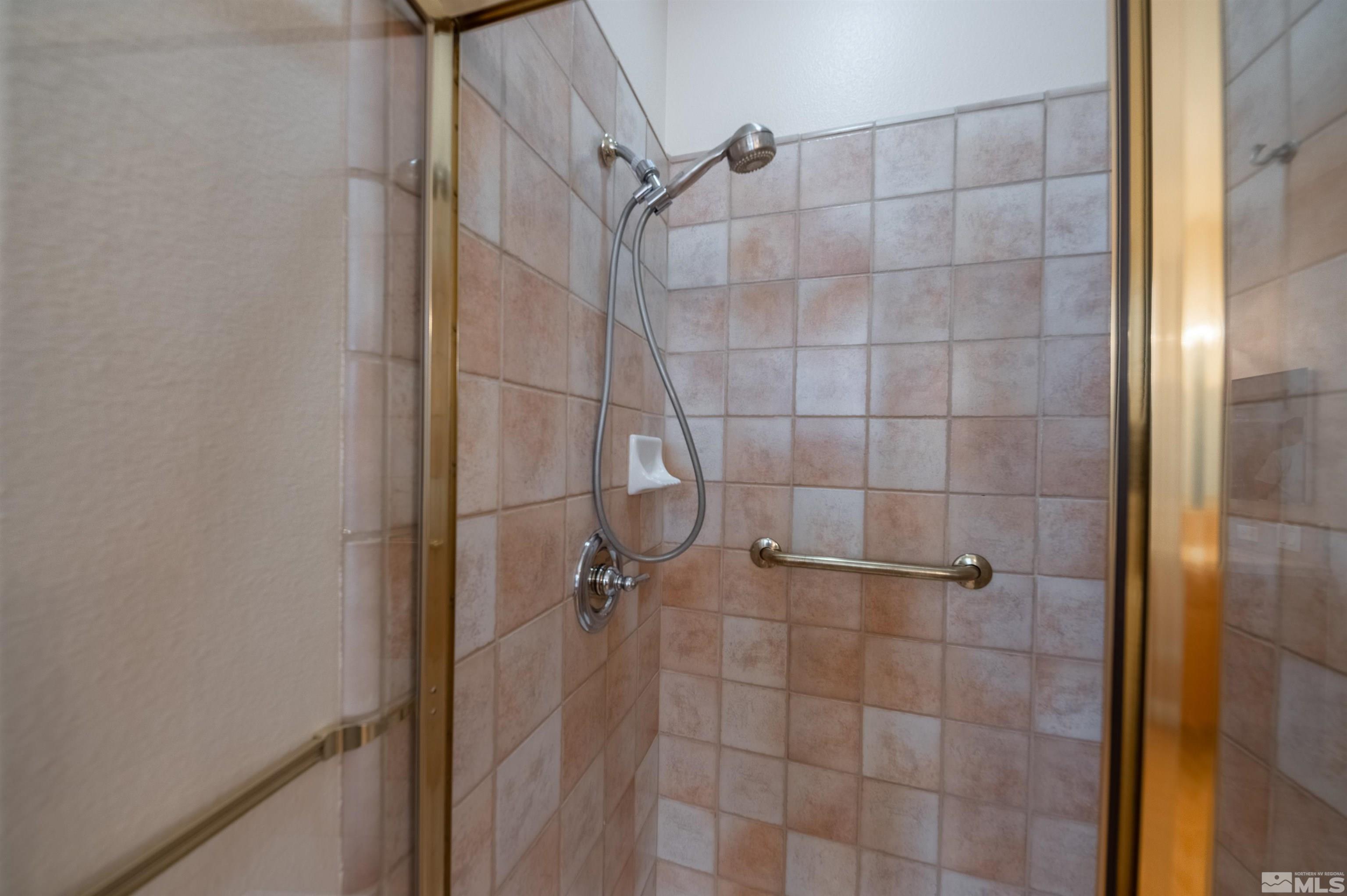 1416 Wild Wolf Way Reno, NV 89521 - Photo 27 of 39 a bathroom with a shower