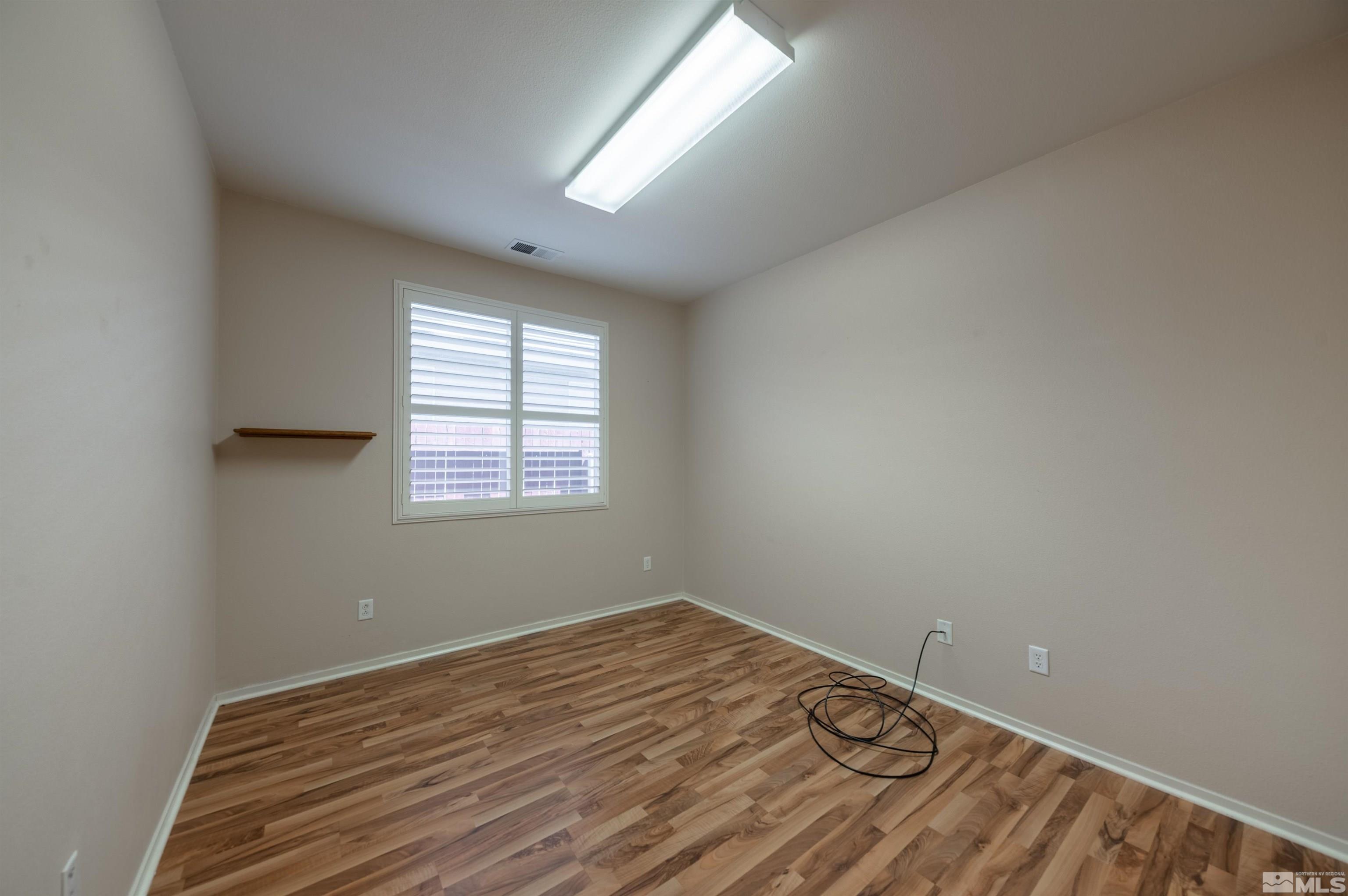 1416 Wild Wolf Way Reno, NV 89521 - Photo 29 of 39 an empty room with a window