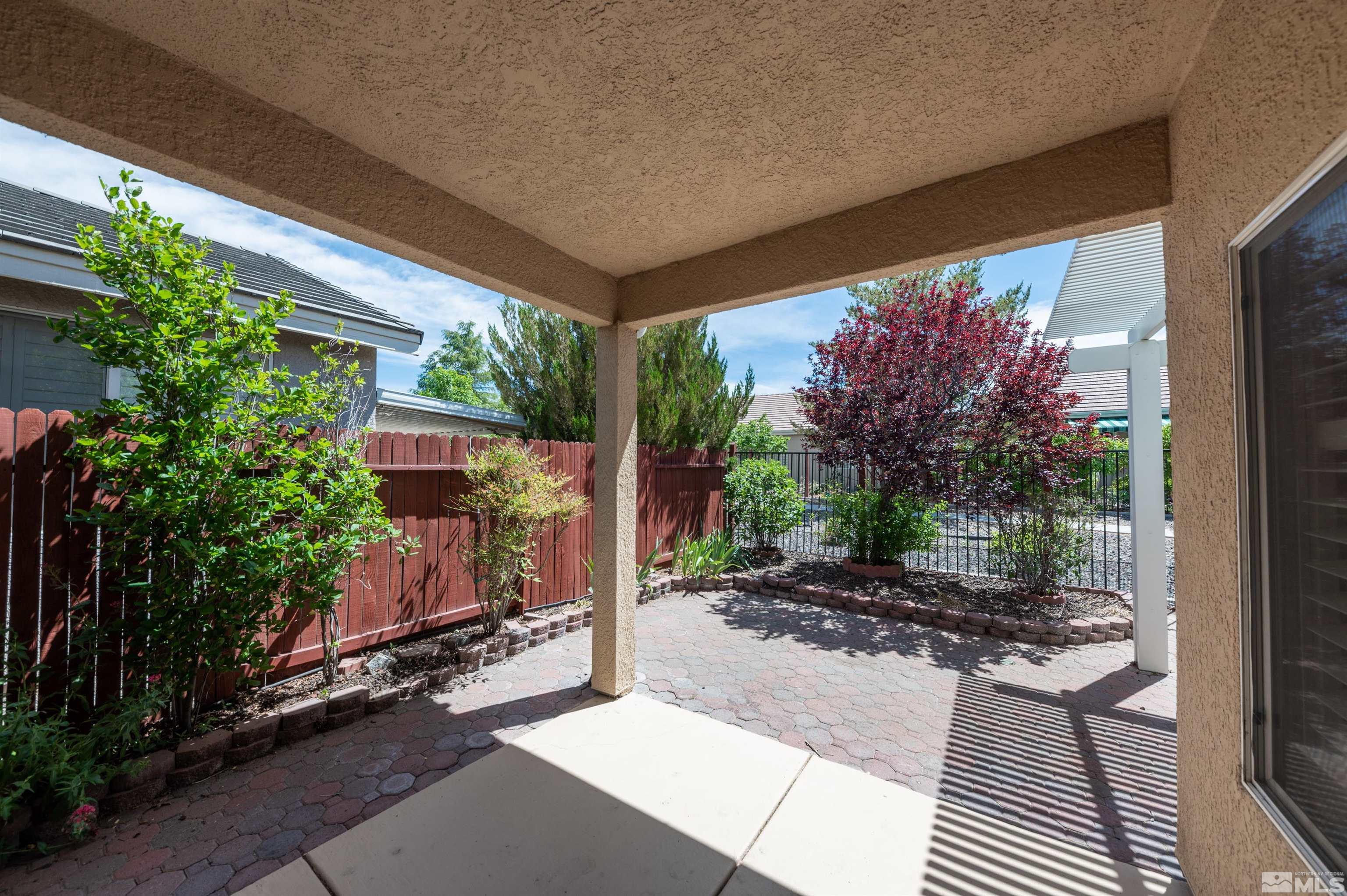 1416 Wild Wolf Way Reno, NV 89521 - Photo 34 of 39 a backyard of a house with lots of green space