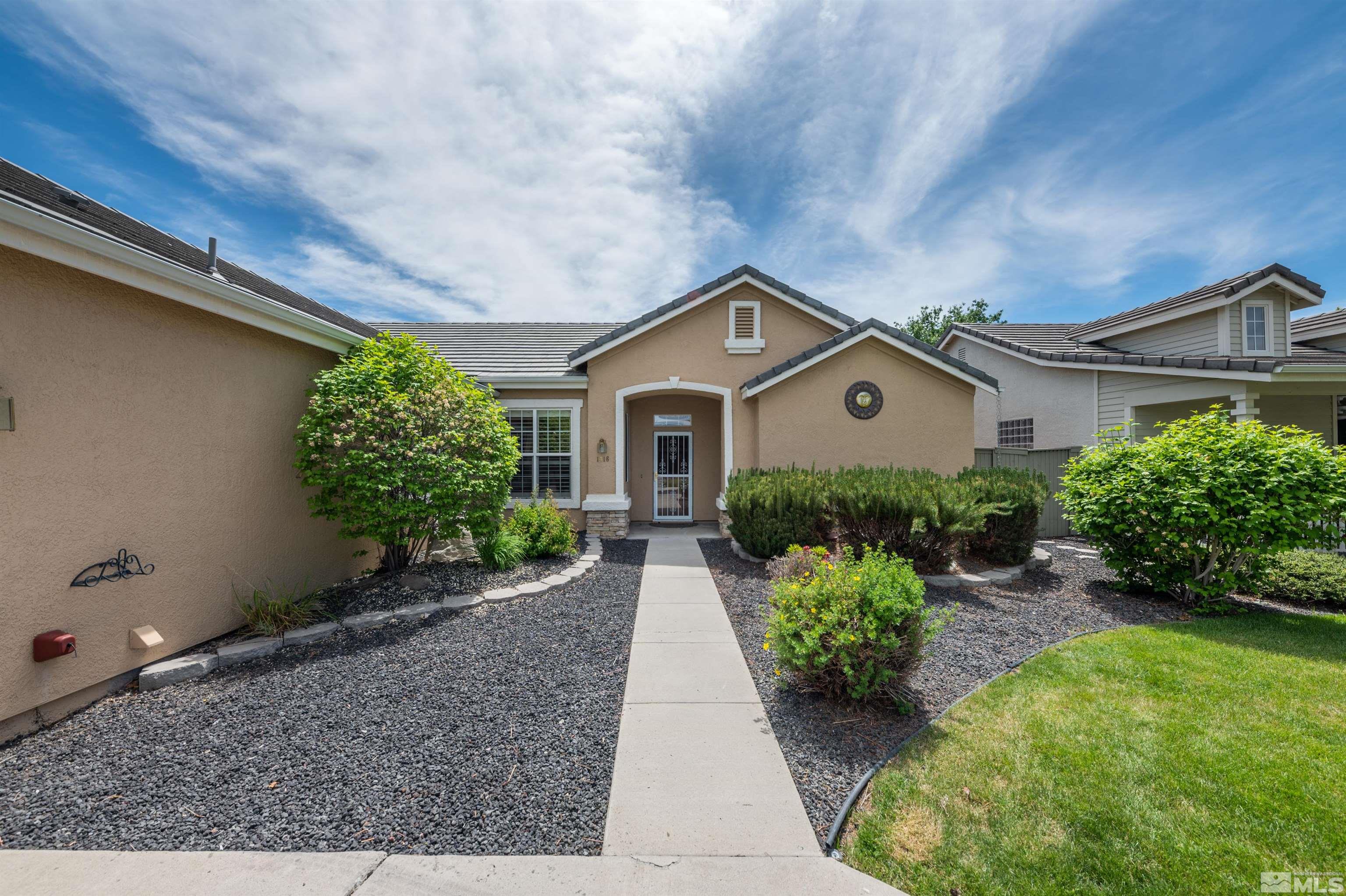 1416 Wild Wolf Way Reno, NV 89521 - Photo 5 of 39 a front view of a house with garden