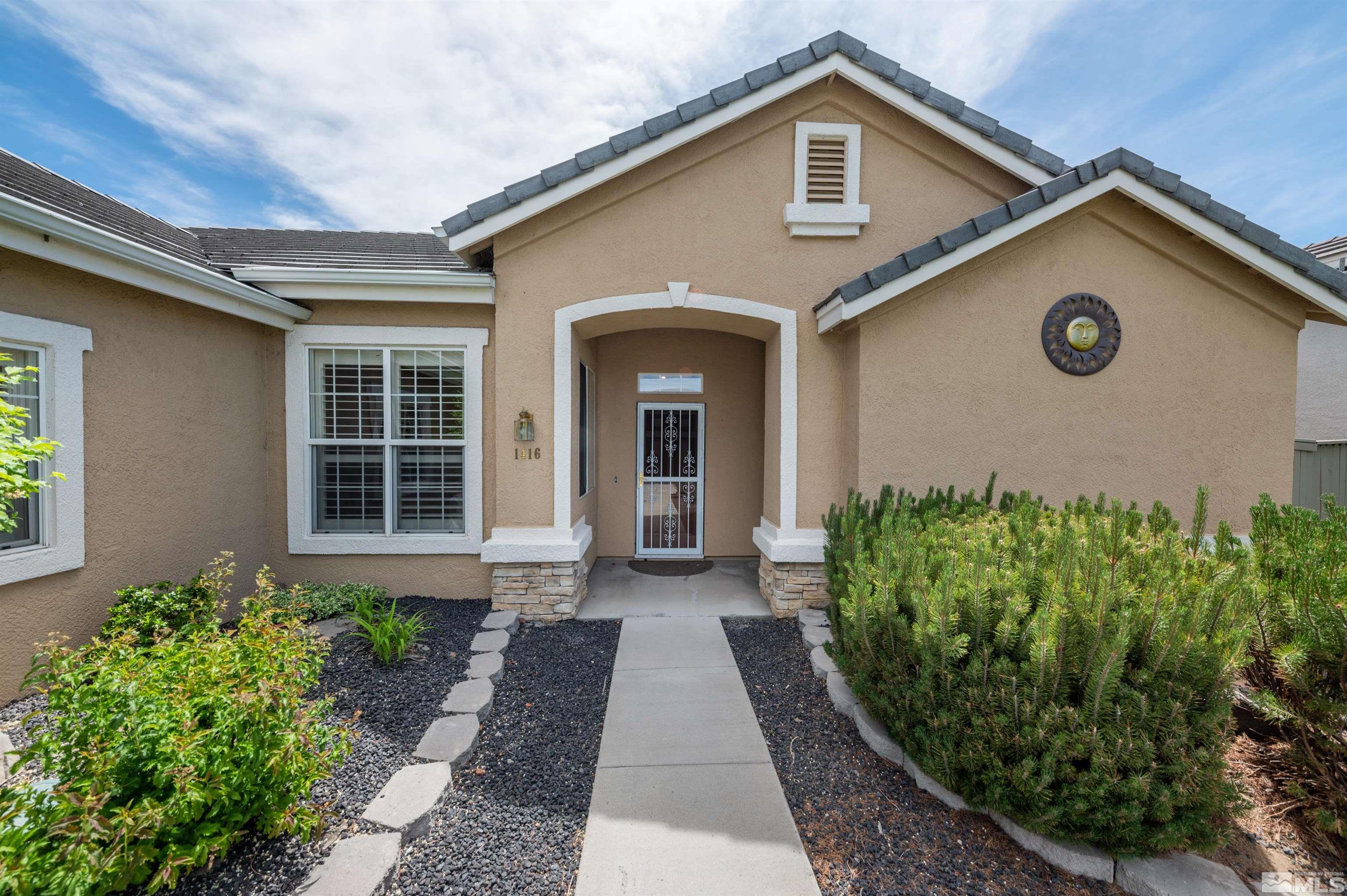1416 Wild Wolf Way Reno, NV 89521 - Photo 6 of 39 a front view of a house with garden