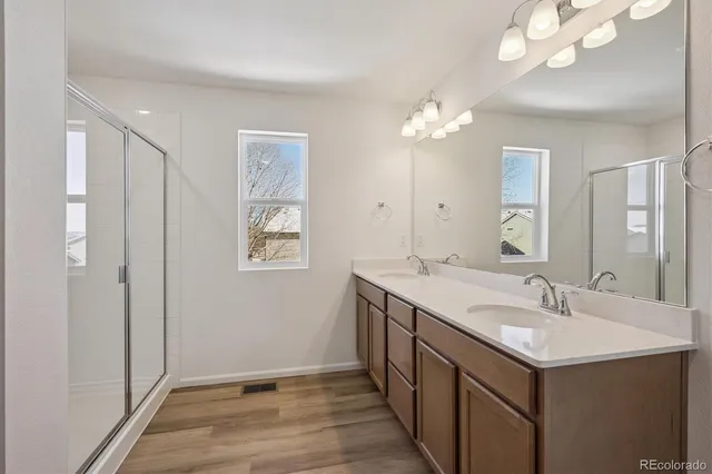 a bathroom with a sink vanity and a mirror